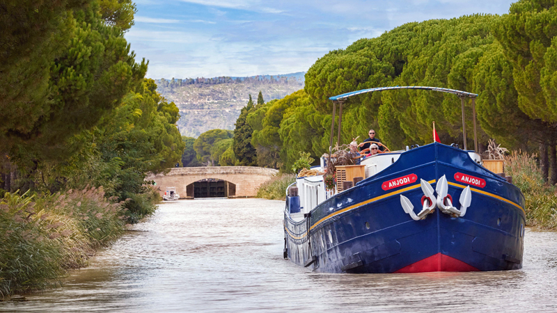 French hotel barge Anjodi cruising the canal du midi