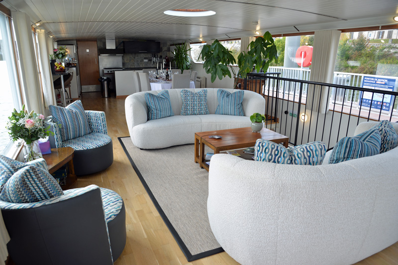 Photos : French Hotel Barge Finesse - Salon looking aft toward dining area and galley