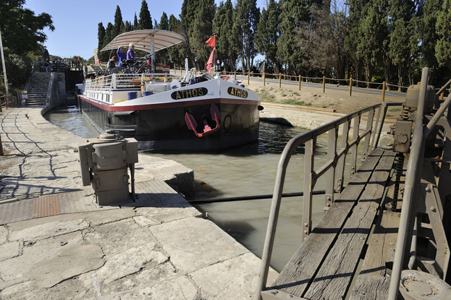 French Hotel Barge Athos in a lock on the canal du midi