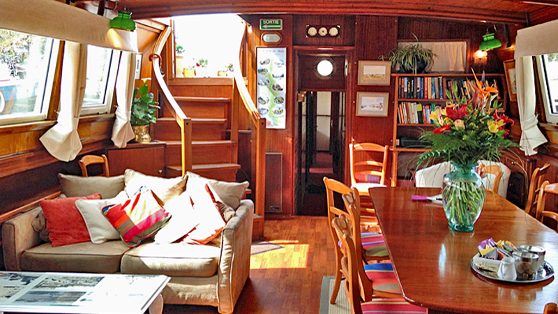 Hotel Barge Athos Salon & Dining. Note the staircase from the deck