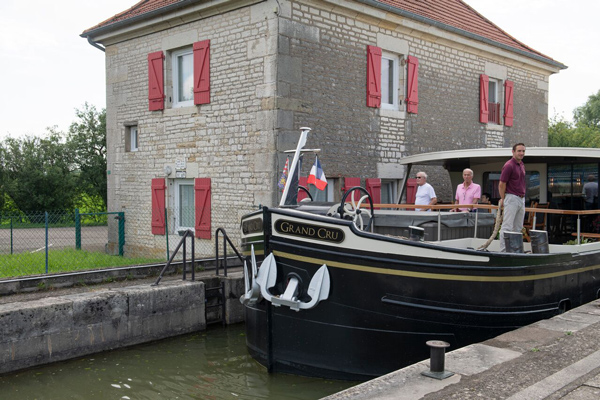 French Hotel Barge Grand Cru entering a lock