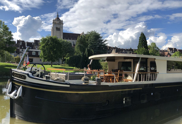French Hotel Barge Grand Cru - Moored on the side of the canal