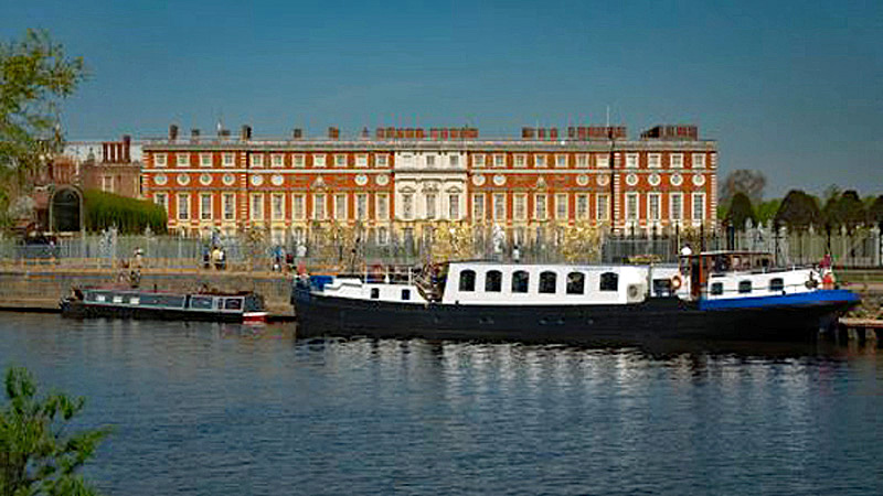 English Hotel Barge Magna Carta moored outside of Hampton