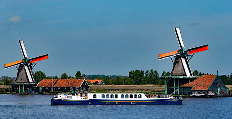 Hotel Barge Panache - Barging in Holland - Dutch windmills in background