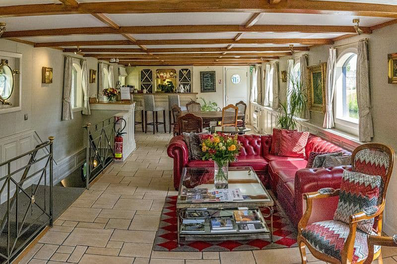 French Hotel Barge Renaissance - Overiew of Main Salon - Sitting area, Dining, & Bar