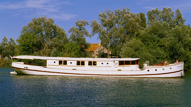 The elegant profile of the French Hotel Barge Roi Soleil. The Sun King refers to Louis XIV of France (1638–1715), who reigned for 72 years.