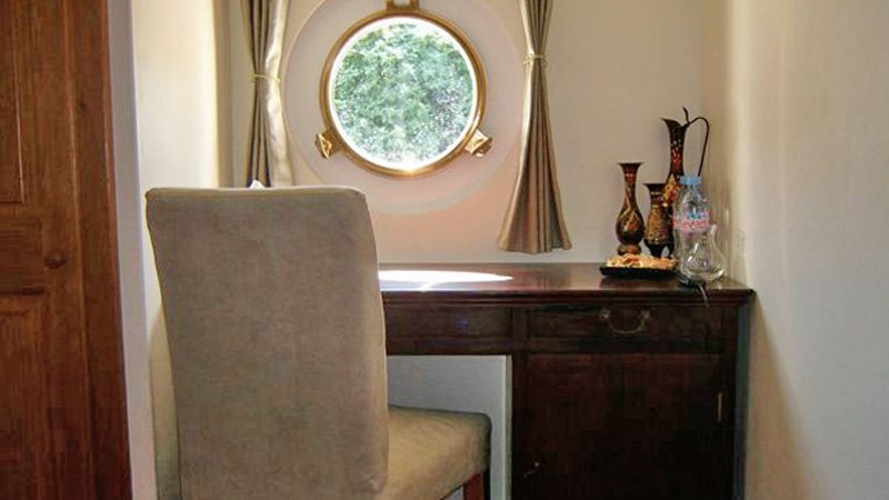 French Hotel Barge Enchante - Deck with porthole in a guest cabin
