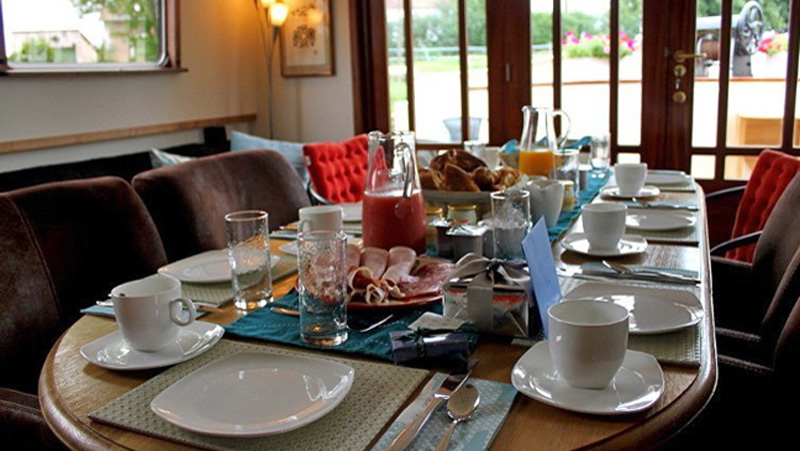 French Hotel Barge Savoir Vivre - Dining table set for breakfast in the salon