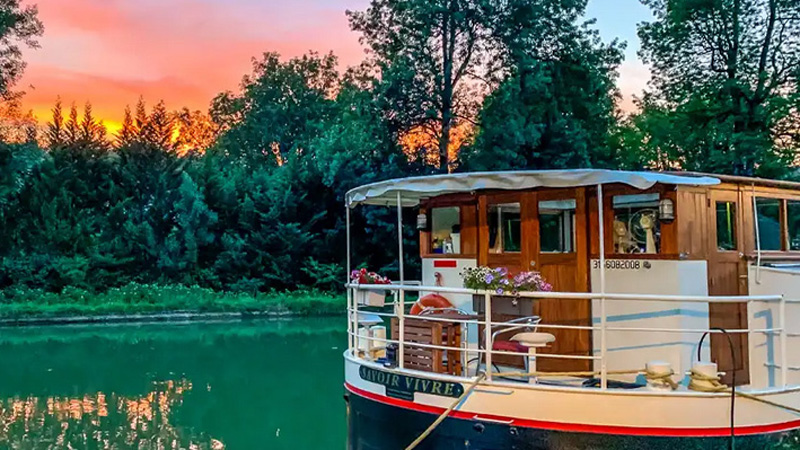 French Hotel Barge Savoir Vivre at sunset