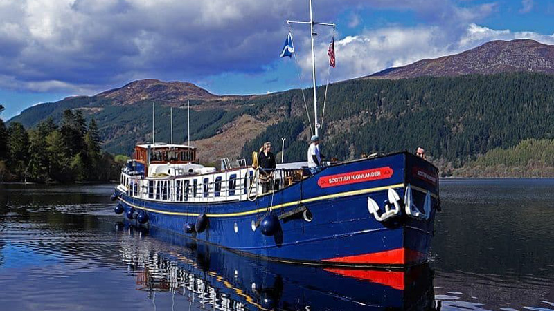Scottish Hotel Barge Scottish Highlander cruising through the impressive countryside of the Scottish Highlands