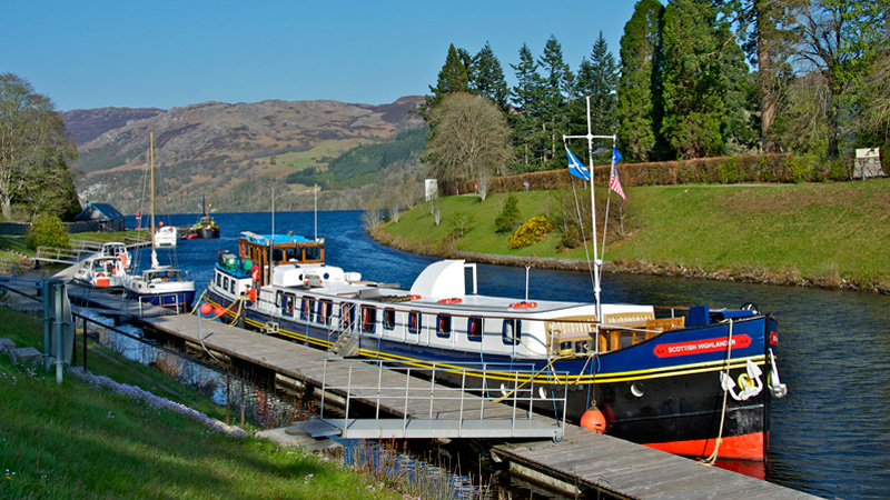 Scottish Hotel Barge Scottish Highlander at a dock