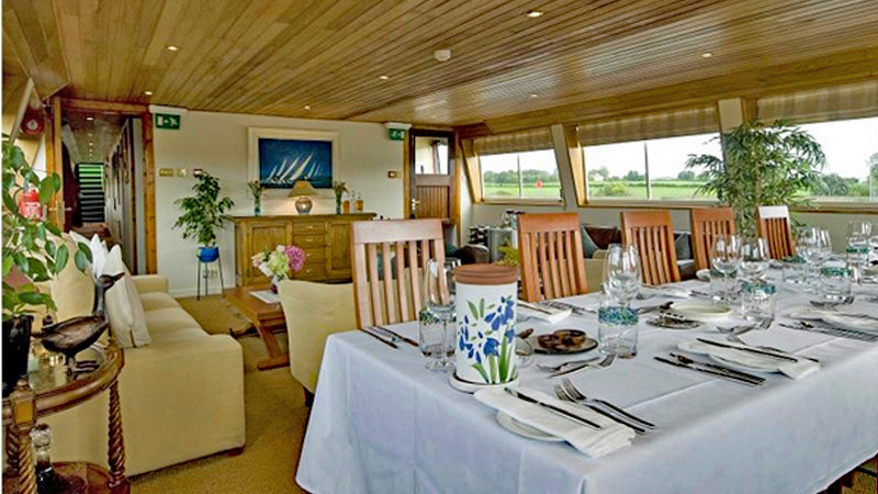 Irish Hotel Barge Shannon Princess - Salon. Dining table is set