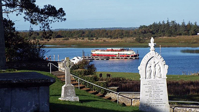 Irish Hotel Barge Shannon Princess docked at a historic site