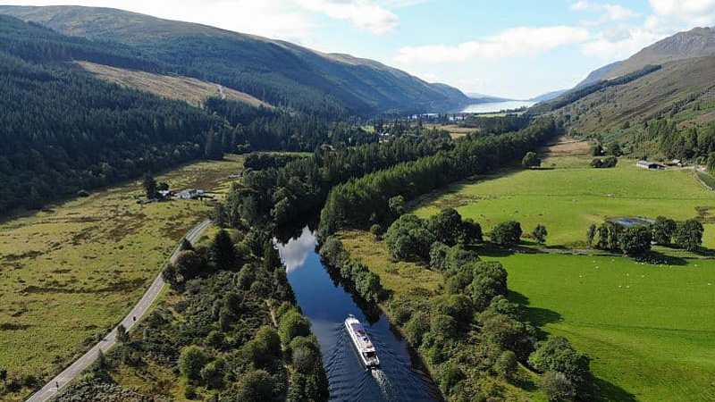 Scottish Hotel Barge Spirit of Scotland cruising through the majestic countryside of the Scottish Highlands