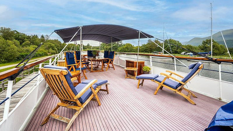 Scottish Hotel Barge Spirit of Scotland - The forward sundeck has shade, table, chairs, and loungers