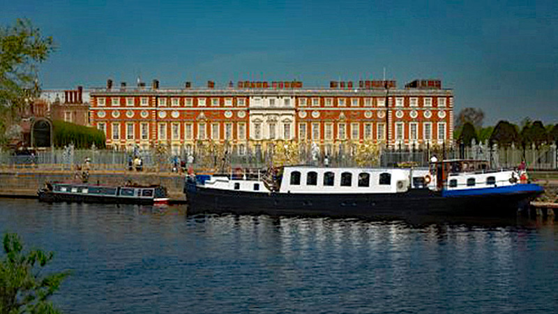 England - Hotel Barge Magna Carta moored outside of Hampton Court. ew