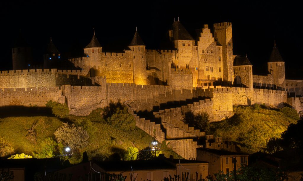 Carcassonne lighted at night. Carcassonne is an outstanding medieval fortified town with double walls and 52 towers. Photo: Pexels - Carlo Giovanni Ghiardelli