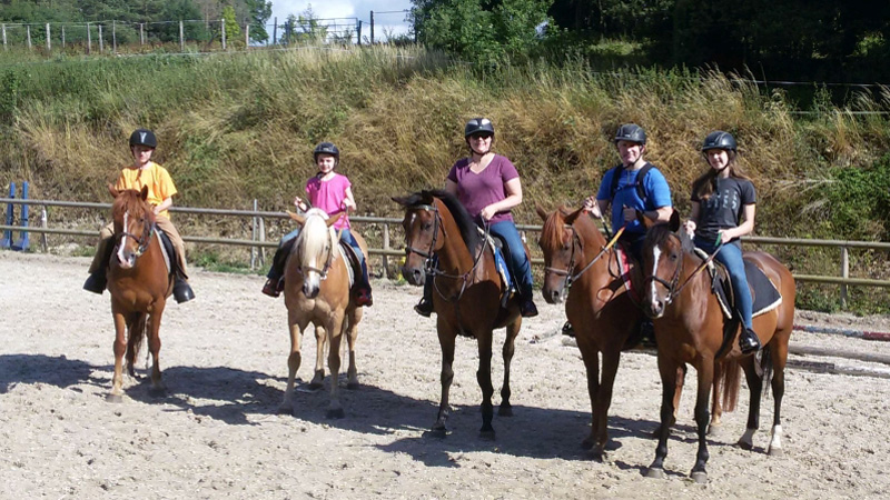 Horseback riding is a fun activity for a family barge charter.