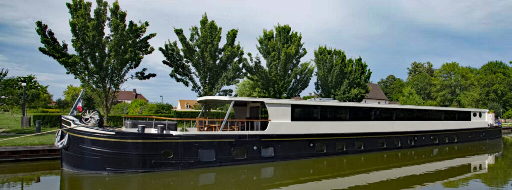 French Hotel Barge Grand Cru moored in Burgundy France