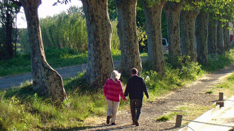 Couple taking a walk on the autumn barge cruise